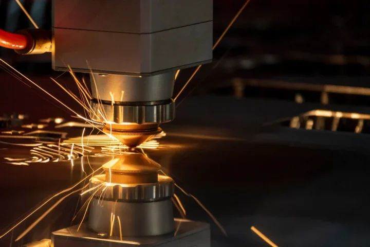 Advanced Laser Cutting Dearborn technology precision-cutting a heavy-duty steel plate for local industrial use