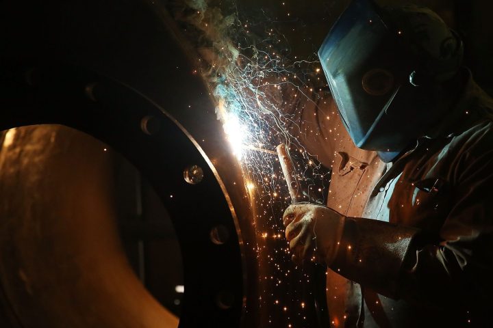 A certified technician performing precision TIG welding to help manufacturers navigate the welder shortage crisis in Michigan